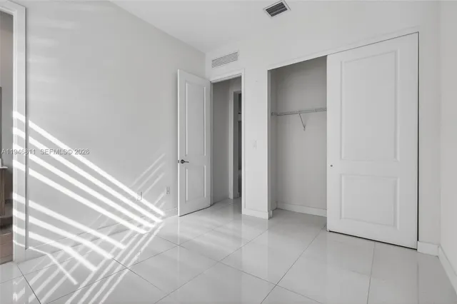 an aerial view of a city with lake