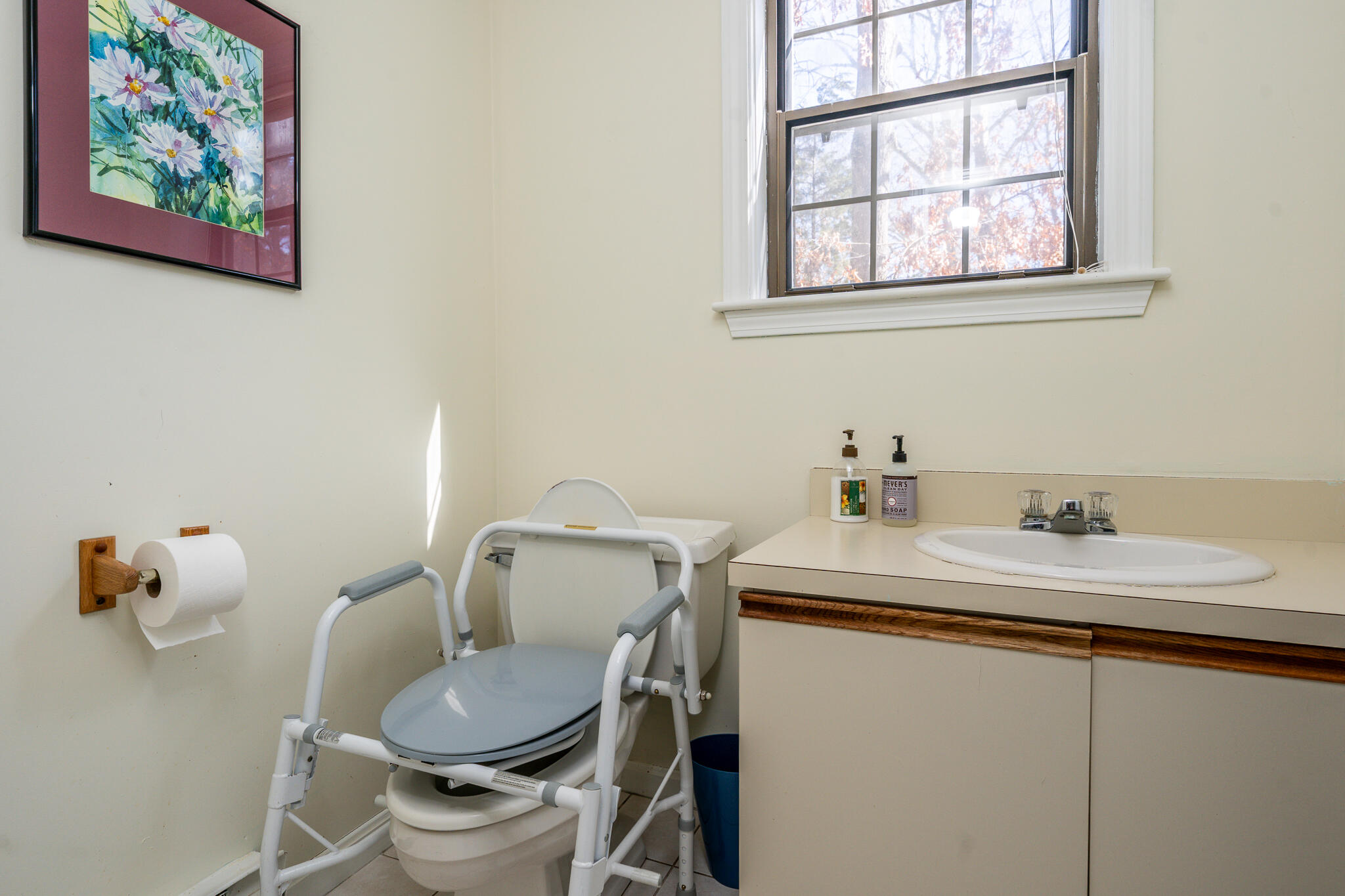 195 Falmouth Road, Unit 9F Mashpee, MA 02649 - Photo 16 of 35 a bathroom with a toilet sink and mirror