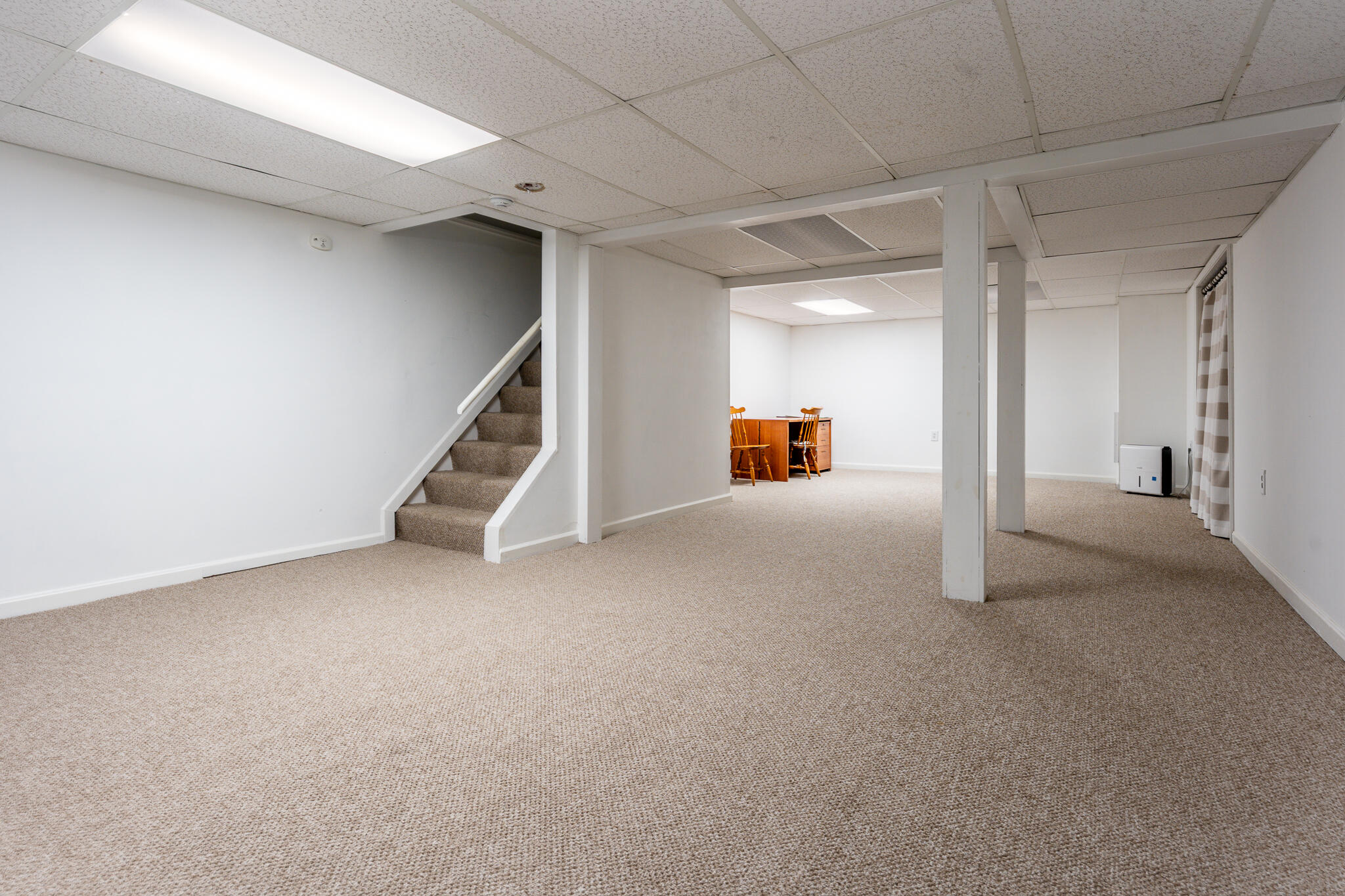 195 Falmouth Road, Unit 9F Mashpee, MA 02649 - Photo 19 of 35 a view of an empty room with a fireplace