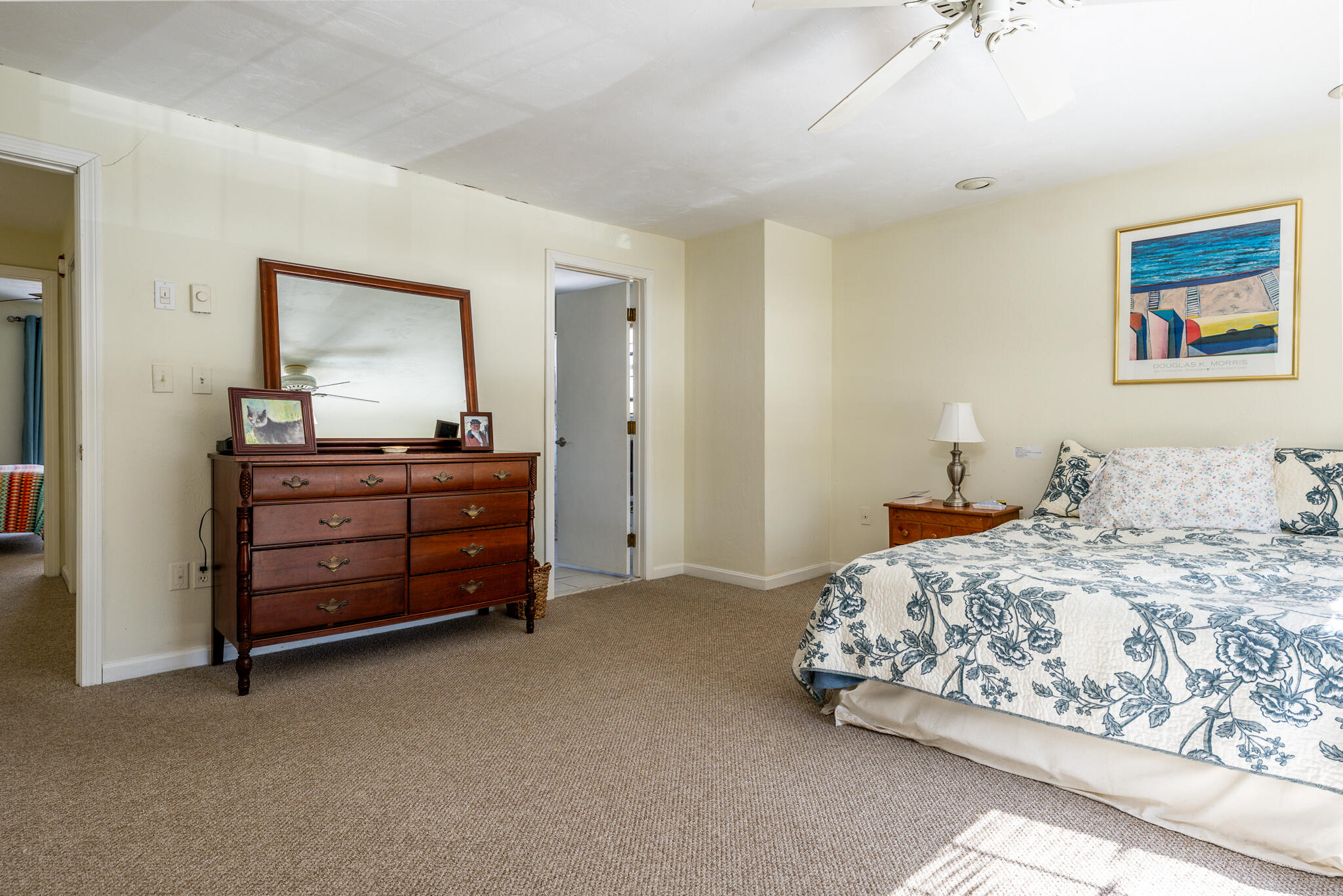 195 Falmouth Road, Unit 9F Mashpee, MA 02649 - Photo 24 of 35 a bedroom with a bed and a dresser