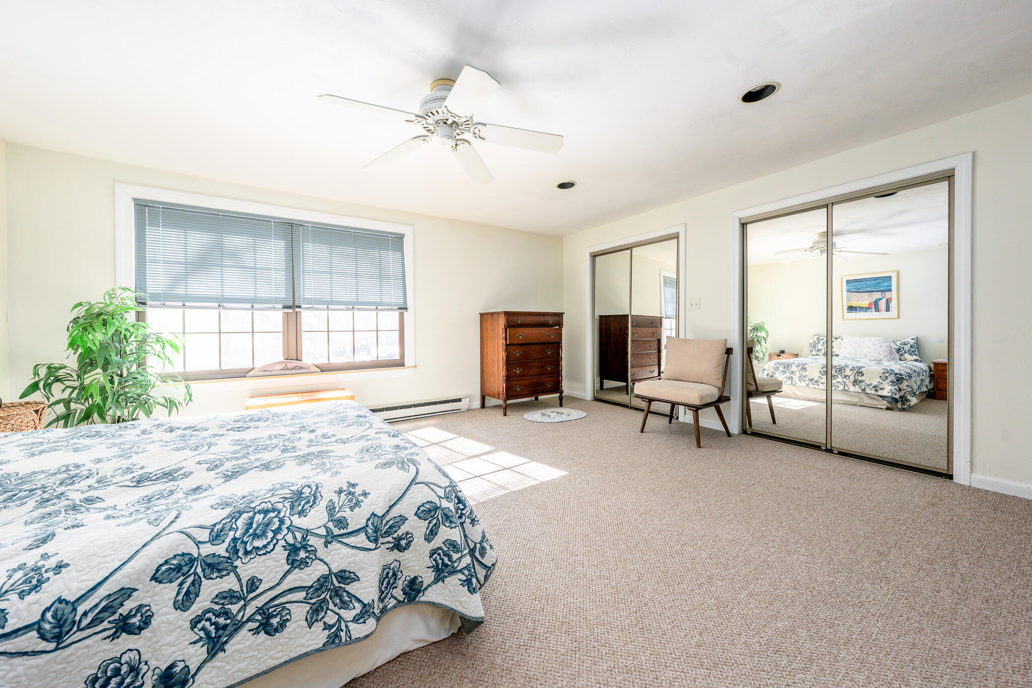 195 Falmouth Road, Unit 9F Mashpee, MA 02649 - Photo 25 of 35 a spacious bedroom with a bed and a couch