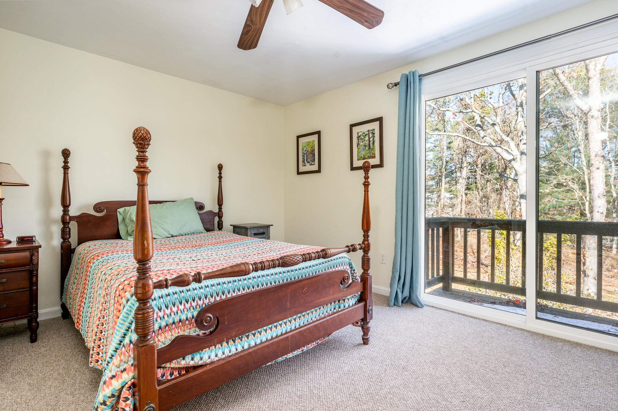 195 Falmouth Road, Unit 9F Mashpee, MA 02649 - Photo 29 of 35 a bed sitting in a bedroom next to a window