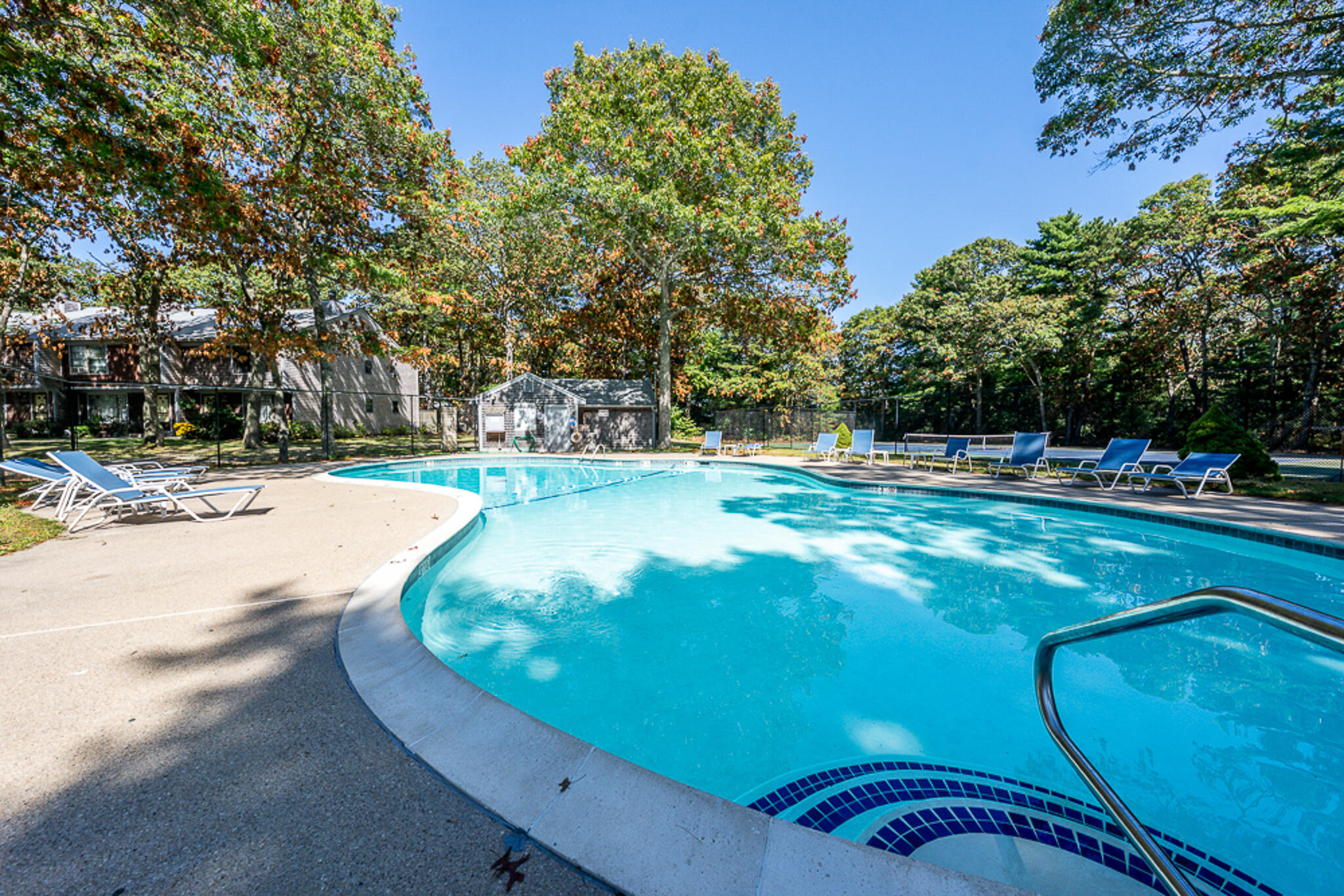 195 Falmouth Road, Unit 9F Mashpee, MA 02649 - Photo 34 of 35 a view of a swimming pool with an outdoor space
