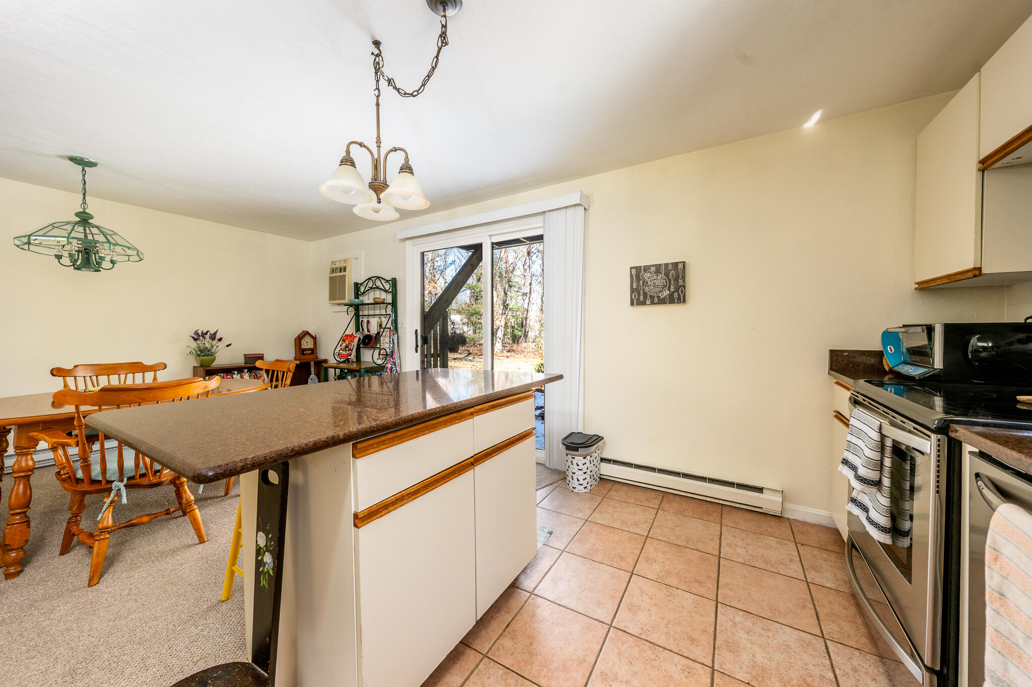 195 Falmouth Road, Unit 9F Mashpee, MA 02649 - Photo 9 of 35 a very nice looking dining room with a table and chairs
