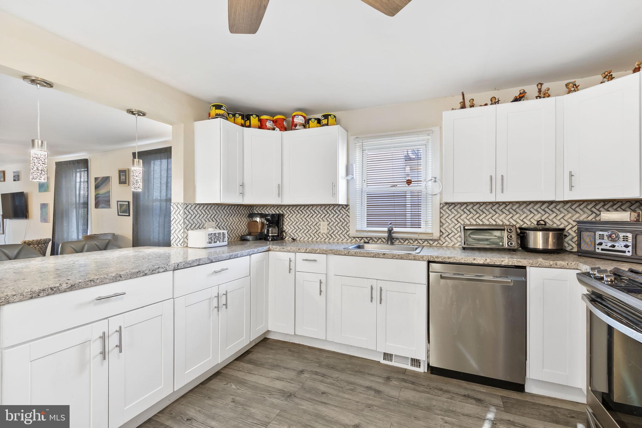 111 Thompson Street Burlington, NJ 08016 - Photo 1 of 25 a kitchen with granite countertop white cabinets and white appliances