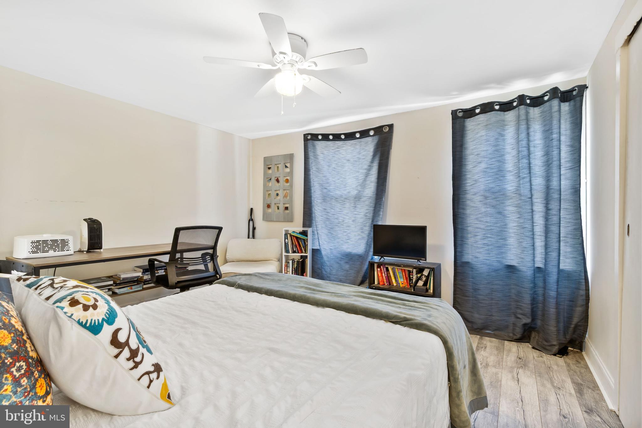 111 Thompson Street Burlington, NJ 08016 - Photo 12 of 25 a bedroom with a bed and a table in it