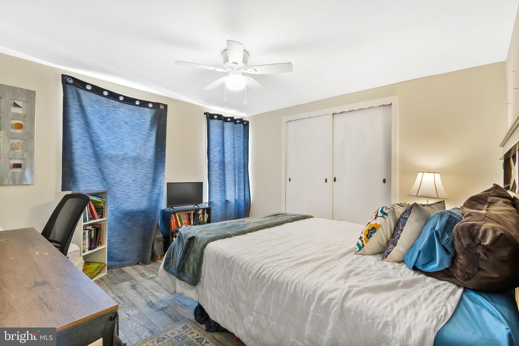 111 Thompson Street Burlington, NJ 08016 - Photo 14 of 25 a bedroom with bed and a chandelier