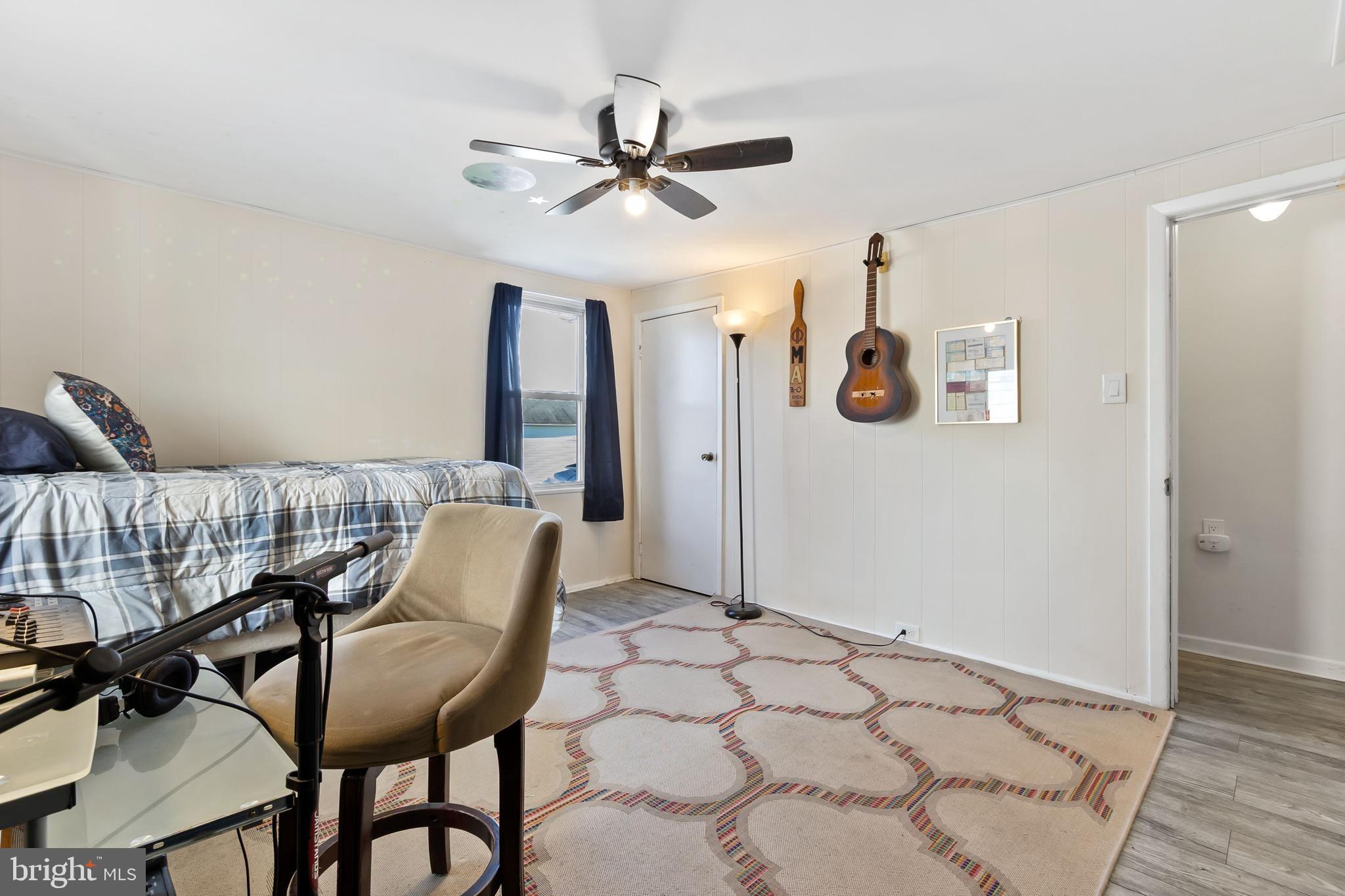 111 Thompson Street Burlington, NJ 08016 - Photo 17 of 25 a view of a livingroom with furniture and a ceiling fan