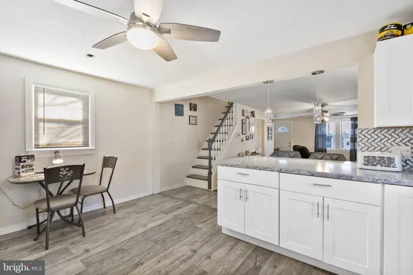 a living room with fireplace furniture and a flat screen tv