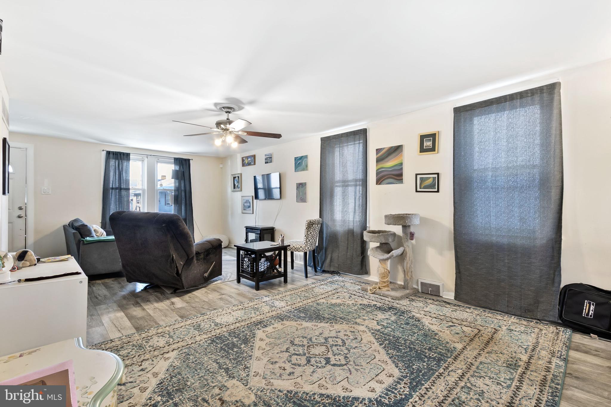 111 Thompson Street Burlington, NJ 08016 - Photo 8 of 25 a living room with furniture a dining table and chair with the potted plants