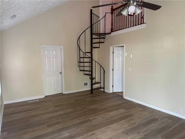 a view of an entryway with wooden floor