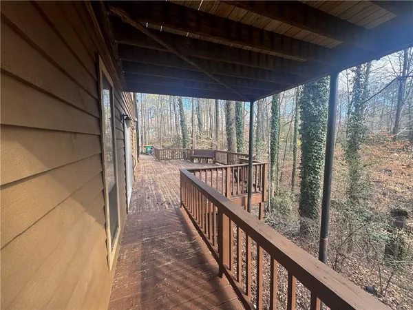 a view of balcony with furniture
