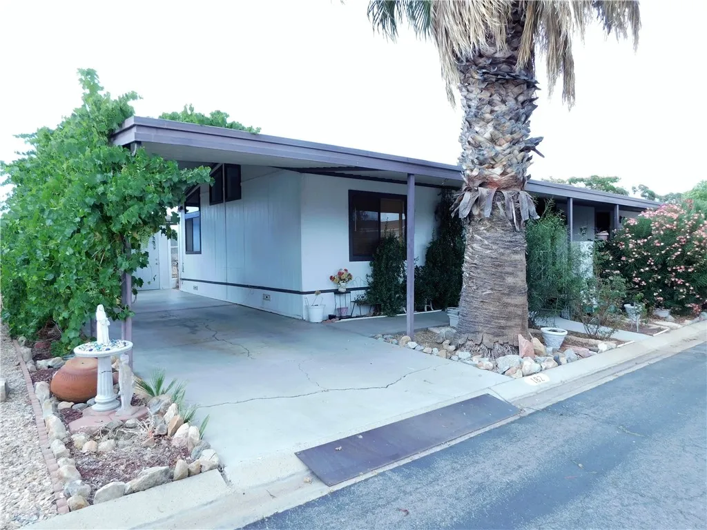 27701 Murrieta Road, Unit 182 Menifee, CA 92586 - Photo 1 of 1 a front view of a house with garden