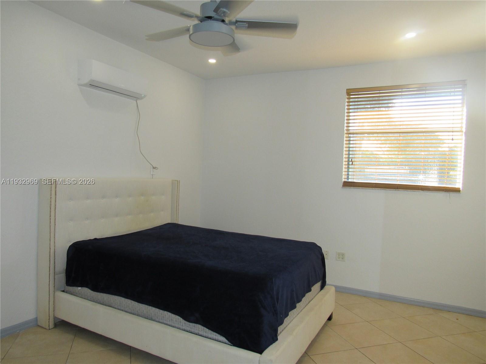 15900 Southwest 54th Place, Unit 1 Southwest Ranches, FL 33331 - Photo 10 of 15 a bedroom with a bed and a window