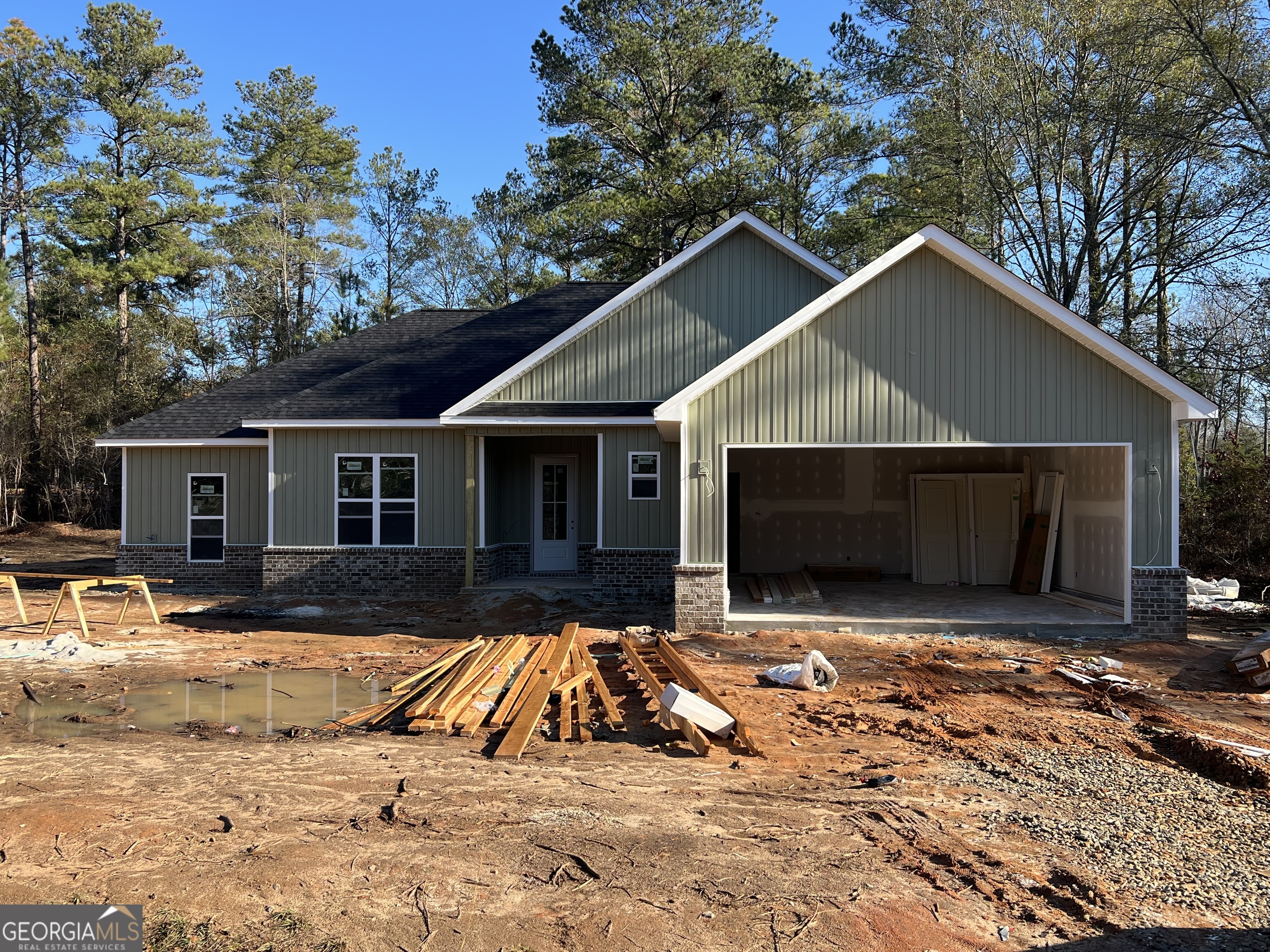 a view of house with yard outdoor space and seating area