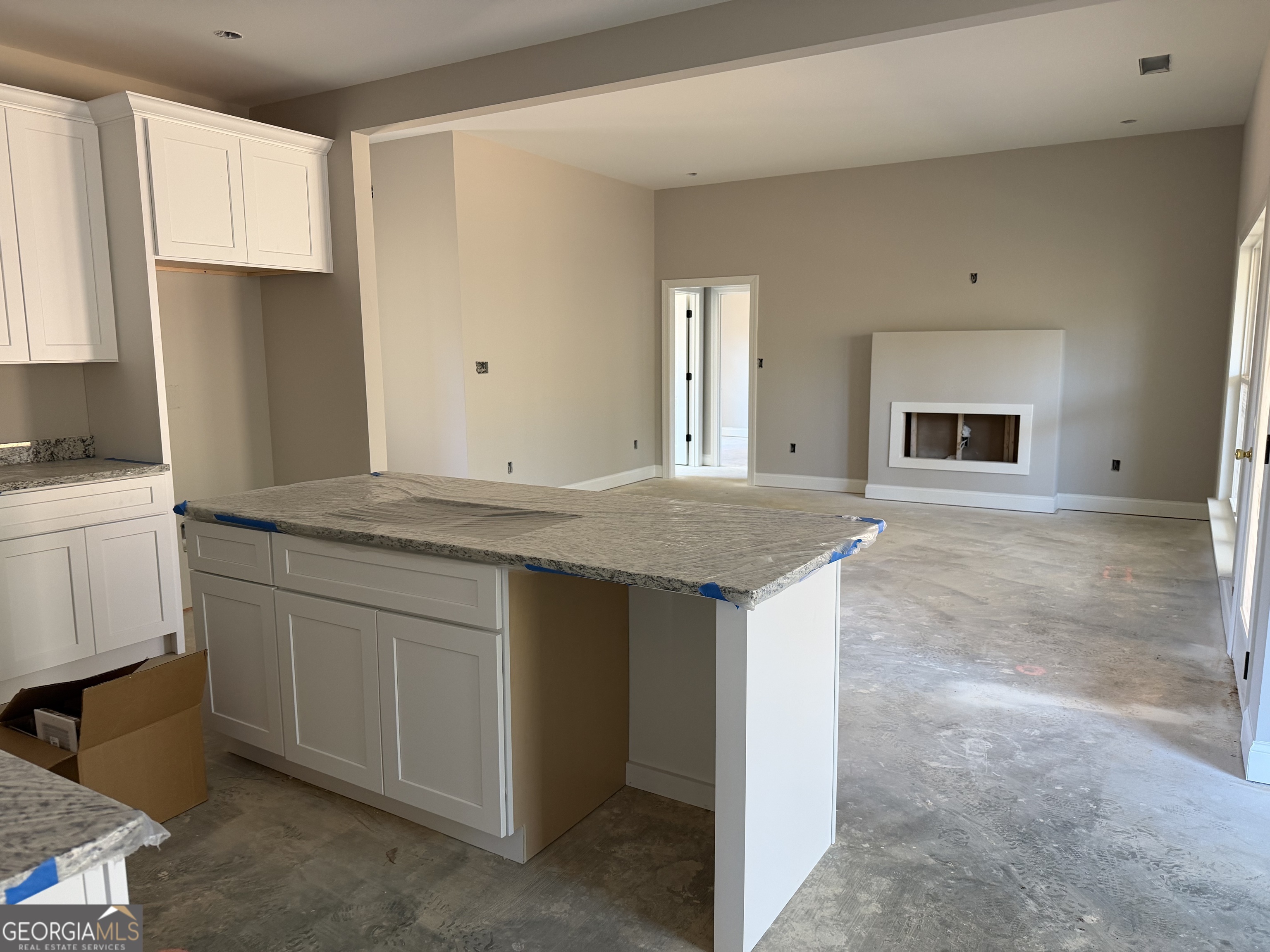 0 Flanders Court Dublin, GA 31021 - Photo 5 of 17 a kitchen with stainless steel appliances granite countertop a stove a sink and a refrigerator with white cabinets