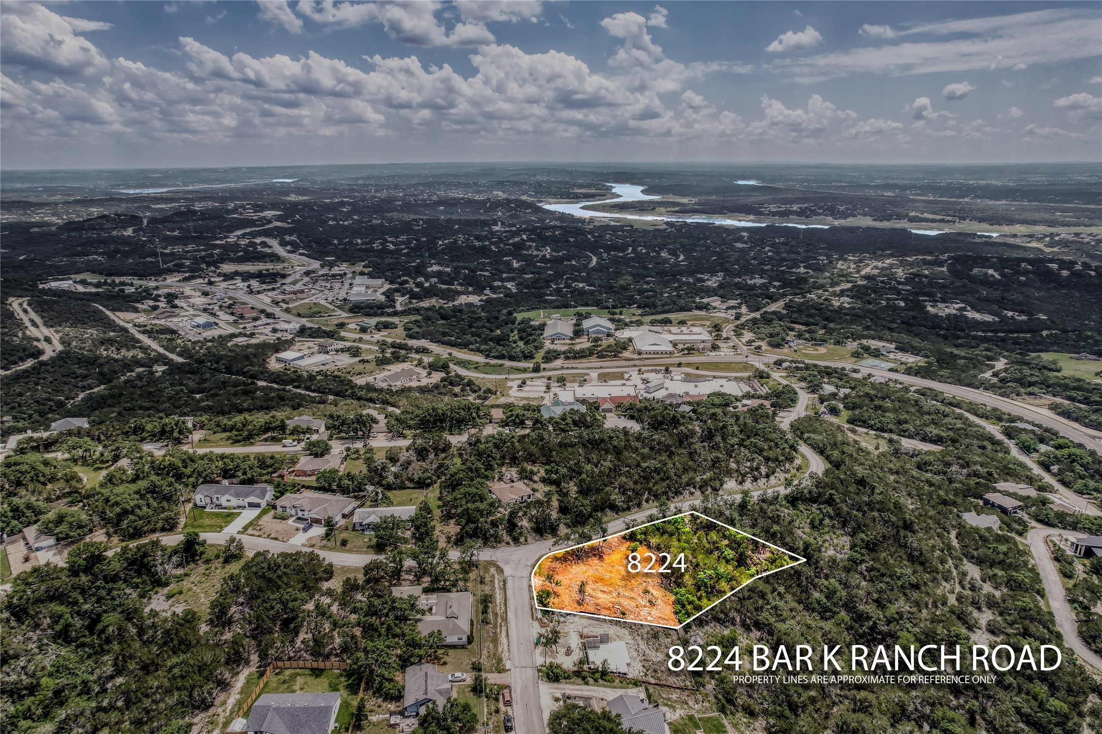8224 Bar K Ranch Road Lago Vista, TX 78645 - Photo 11 of 25 an aerial view of residential building and car parked