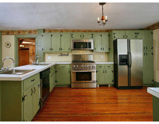 2 Parker Road Shirley, MA 01464 - Photo 7 of 15 a kitchen with stainless steel appliances a stove refrigerator and a sink