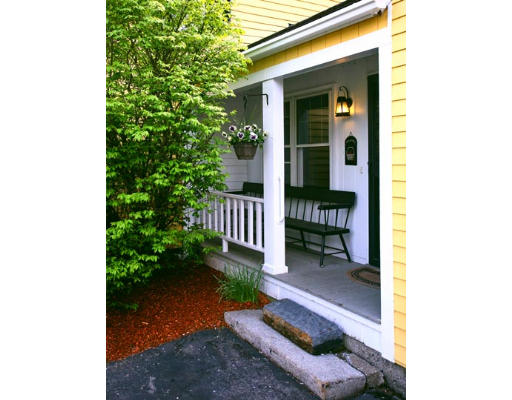 2 Parker Road Shirley, MA 01464 - Photo 10 of 15 a backyard of a house with plants and outdoor seating