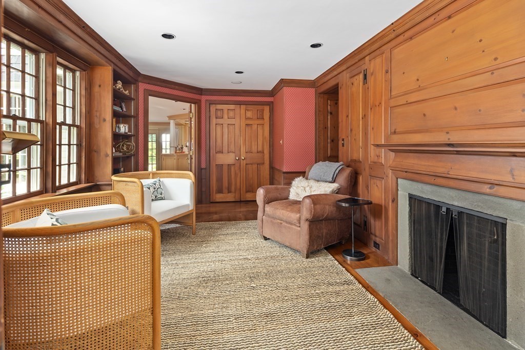 30 Arnold Road Hingham, MA 02043 - Photo 14 of 37 a living room with furniture a fireplace and a table