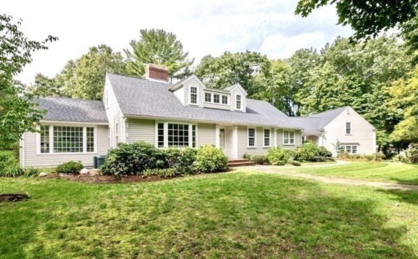 30 Arnold Road Hingham, MA 02043 - Photo 2 of 37 a front view of a house with a yard and trees