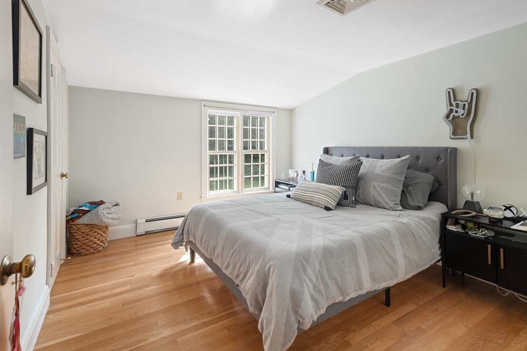 30 Arnold Road Hingham, MA 02043 - Photo 24 of 37 a bedroom with a bed and a window