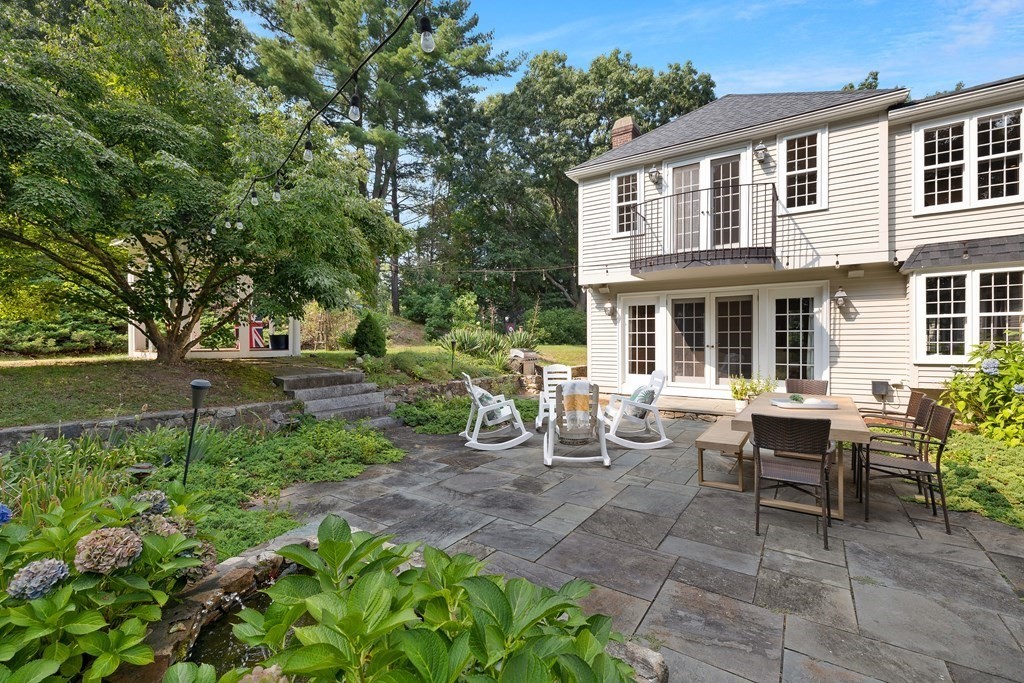 30 Arnold Road Hingham, MA 02043 - Photo 29 of 37 a view of a house with backyard sitting area and garden