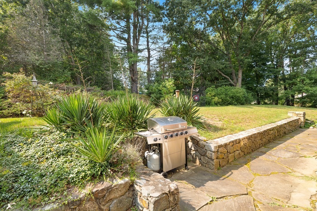 30 Arnold Road Hingham, MA 02043 - Photo 30 of 37 a view of a swimming pool with lawn chairs under an umbrella