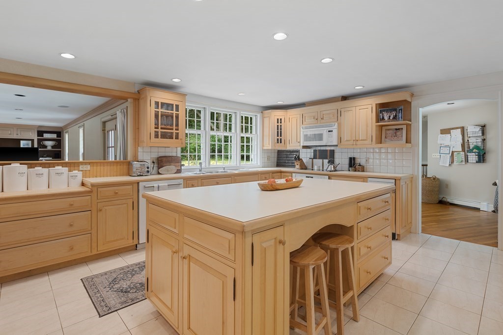 30 Arnold Road Hingham, MA 02043 - Photo 5 of 37 a kitchen with stainless steel appliances a sink stove and cabinets