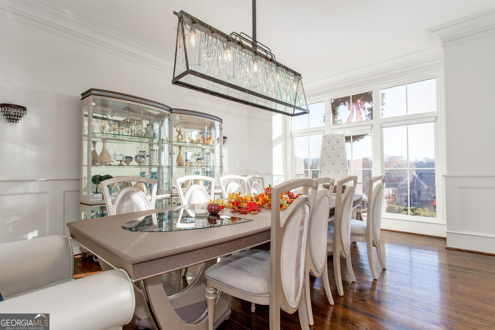 3084 Watson's Bend Milton, GA 30004 - Photo 13 of 95 a view of a dining room with furniture window and wooden floor