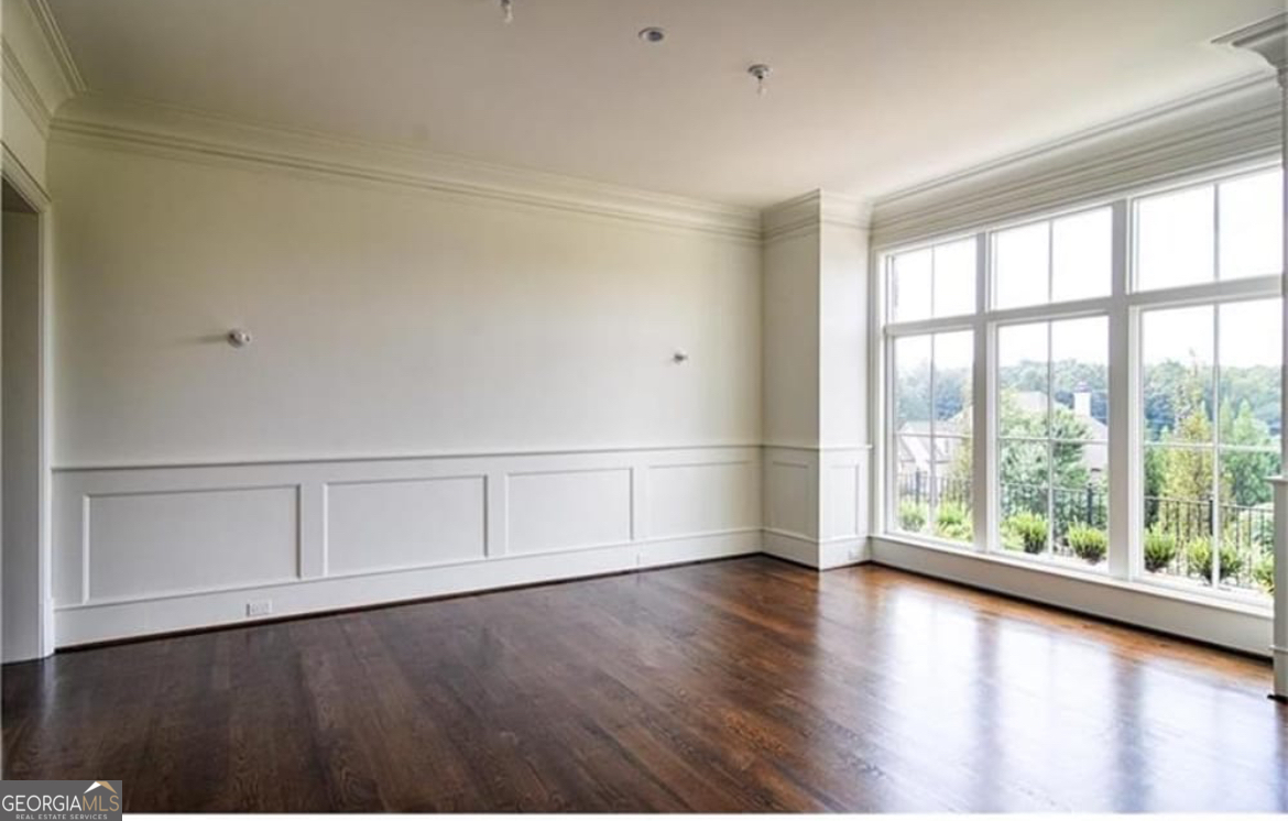 3084 Watson's Bend Milton, GA 30004 - Photo 15 of 95 wooden floor in an empty room with a window