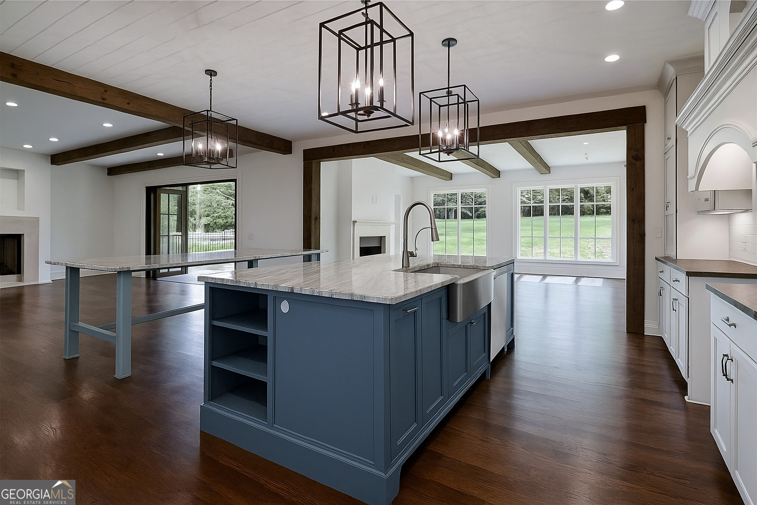 3084 Watson's Bend Milton, GA 30004 - Photo 16 of 95 a kitchen with stainless steel appliances granite countertop a large stove a sink dishwasher and a fireplace with wooden floor