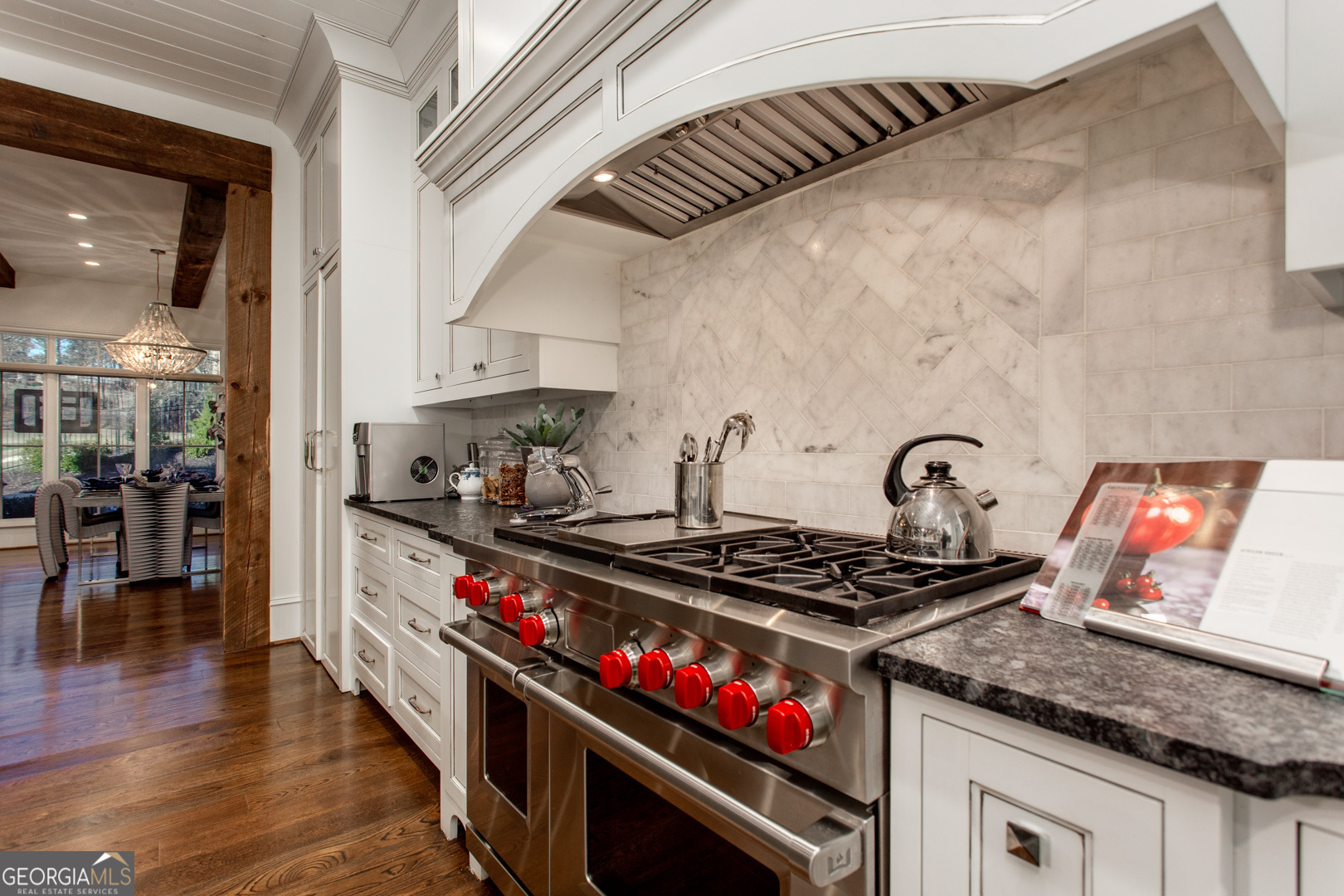 3084 Watson's Bend Milton, GA 30004 - Photo 18 of 95 a kitchen with granite countertop stainless steel appliances and wooden floor