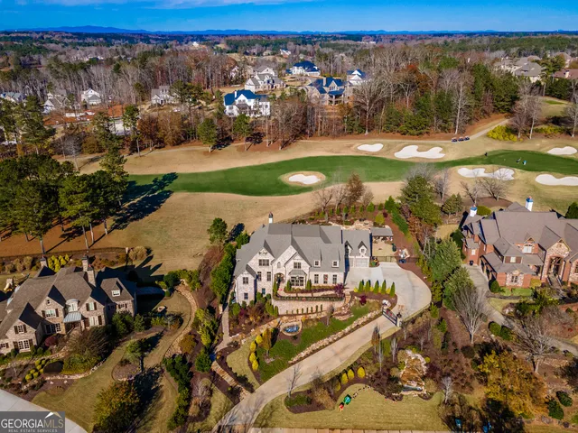 a living room with fireplace furniture and a wooden floor