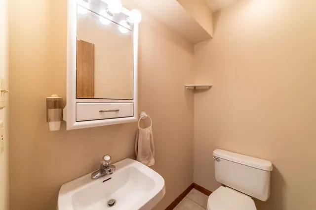 an empty room with a ceiling fan and window