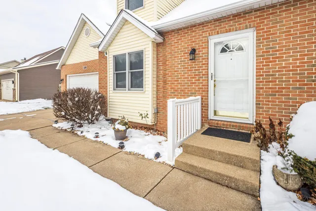 a front view of a house with a garage