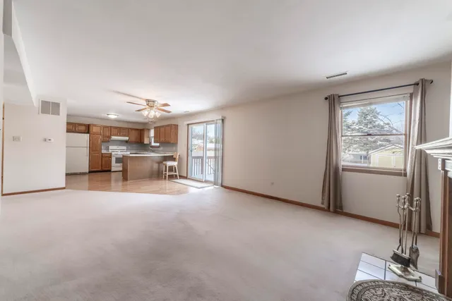 a view of a livingroom with furniture and windows
