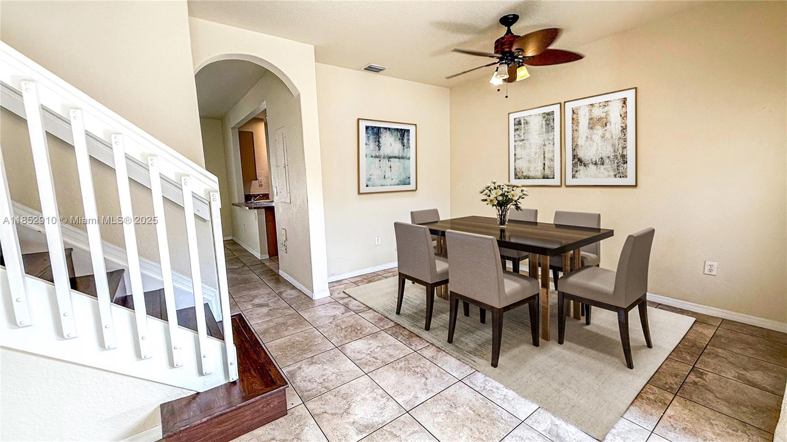 3361 Merrick Lane, Unit 808 Margate, FL 33063 - Photo 2 of 13 a dining room with wooden floor and a chandelier