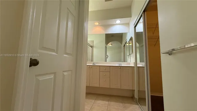 a bathroom with a shower and a sink