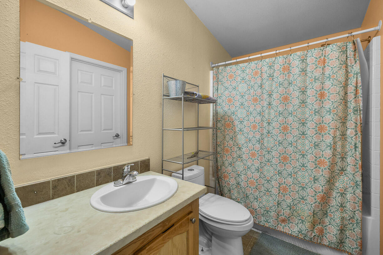 67500 Harrington Loop Road Bend, OR 97703 - Photo 22 of 72 a bathroom with a sink and a mirror