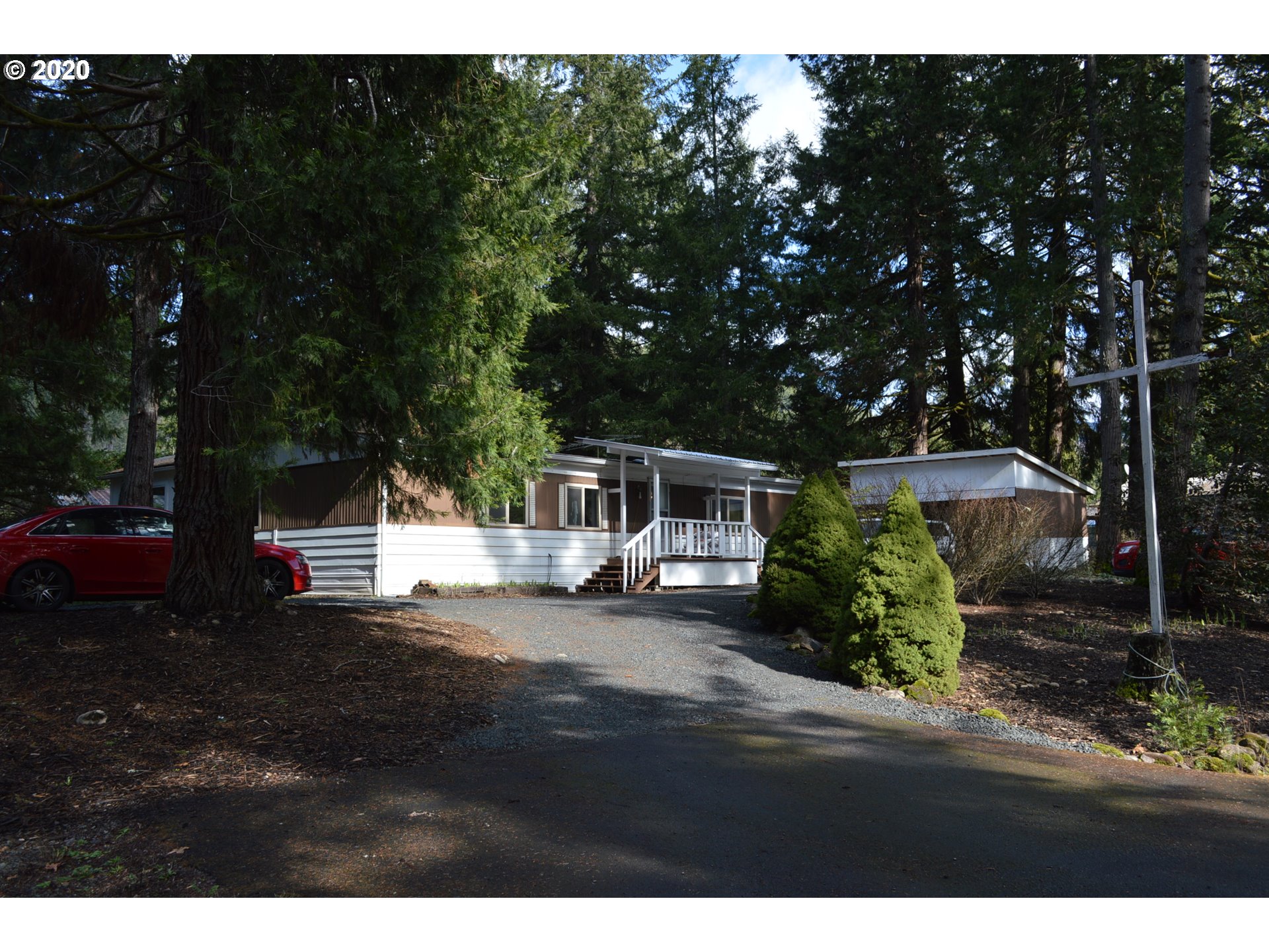38181 Row River Road Dorena, OR 97434 - Photo 1 of 24 a view of a house with backyard and sitting area