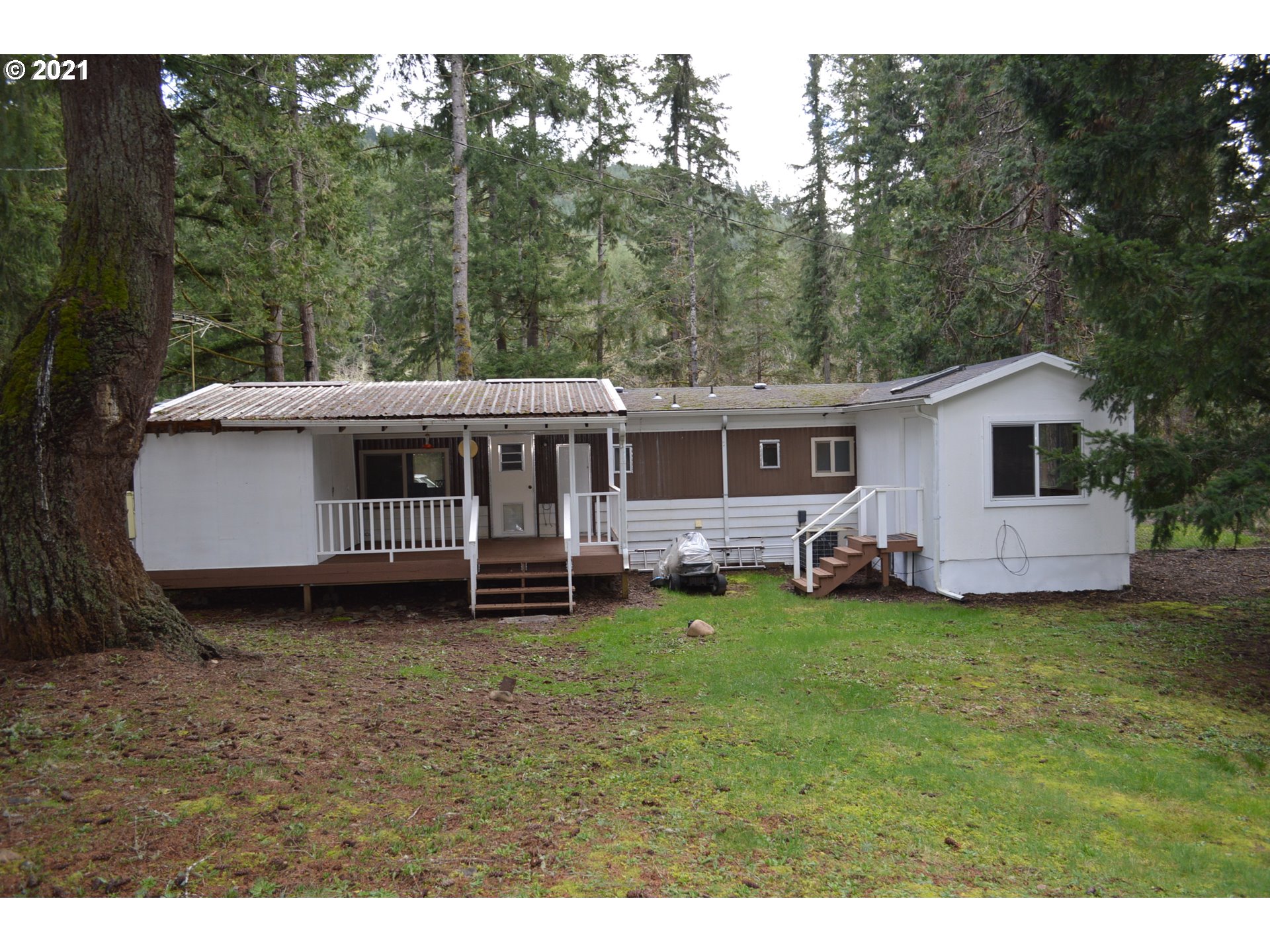 38181 Row River Road Dorena, OR 97434 - Photo 12 of 24 a view of a house with backyard
