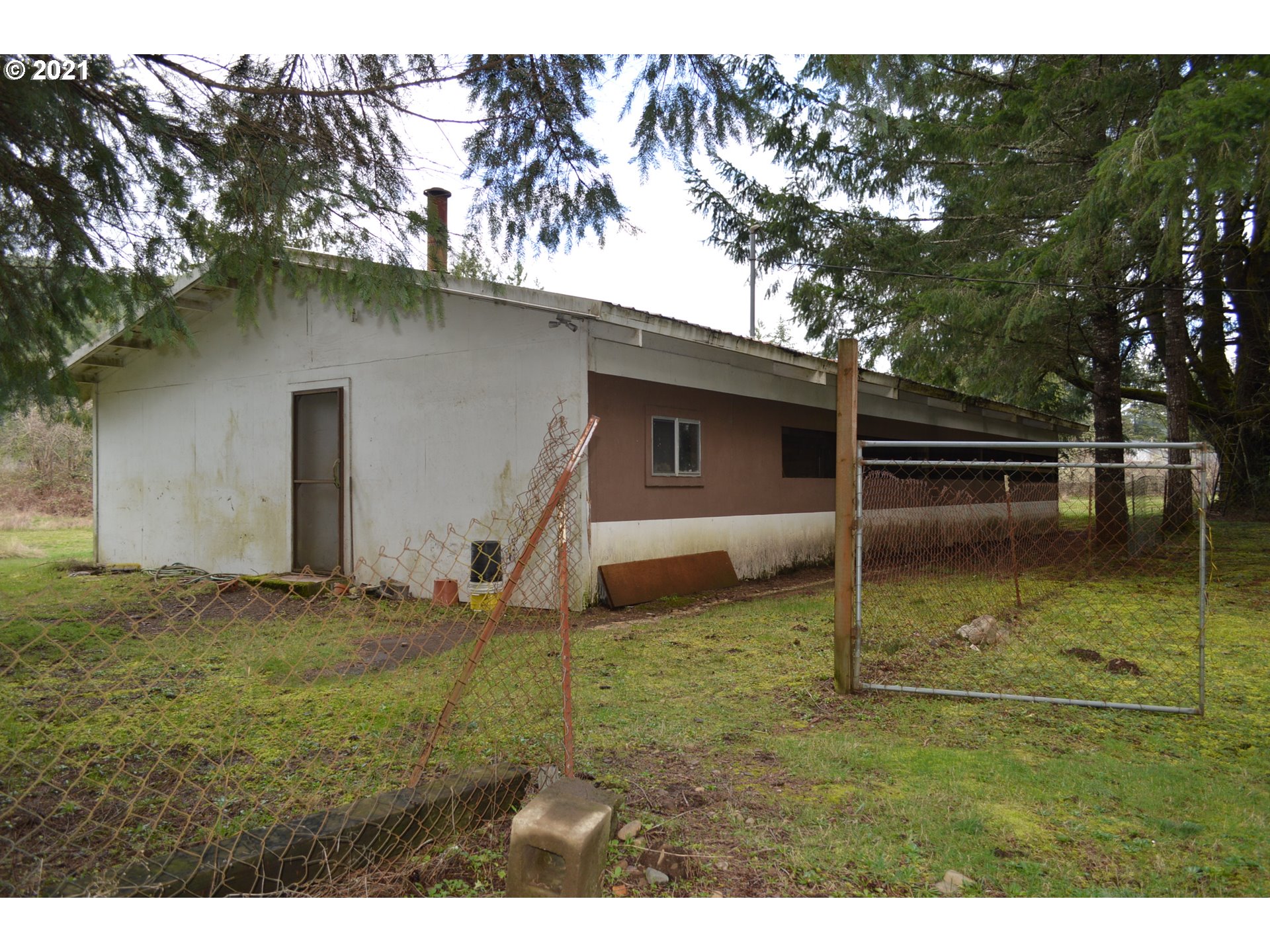 38181 Row River Road Dorena, OR 97434 - Photo 13 of 24 a backyard of a house with lots of green space