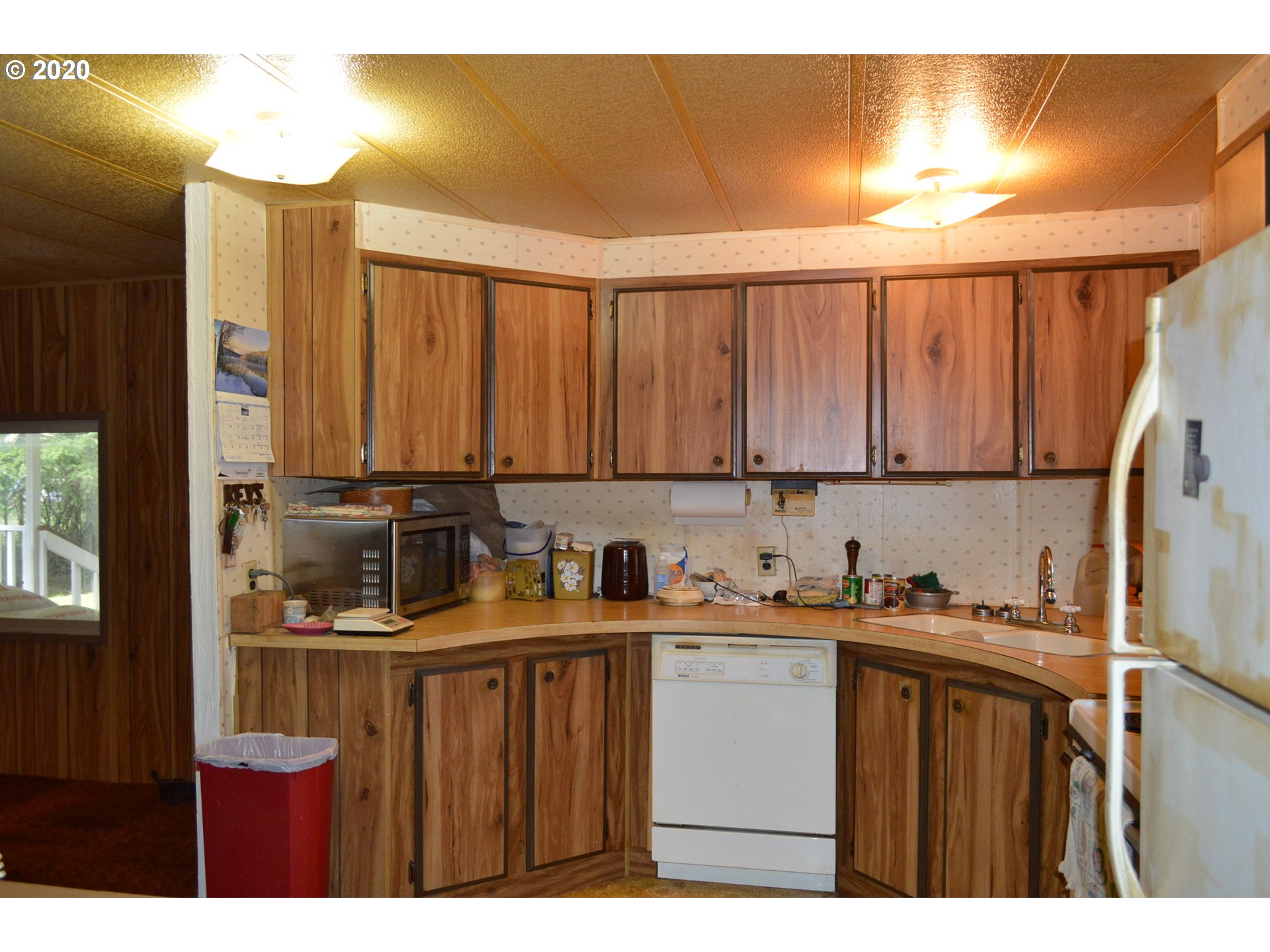 38181 Row River Road Dorena, OR 97434 - Photo 3 of 24 a kitchen with a sink a cabinets and window