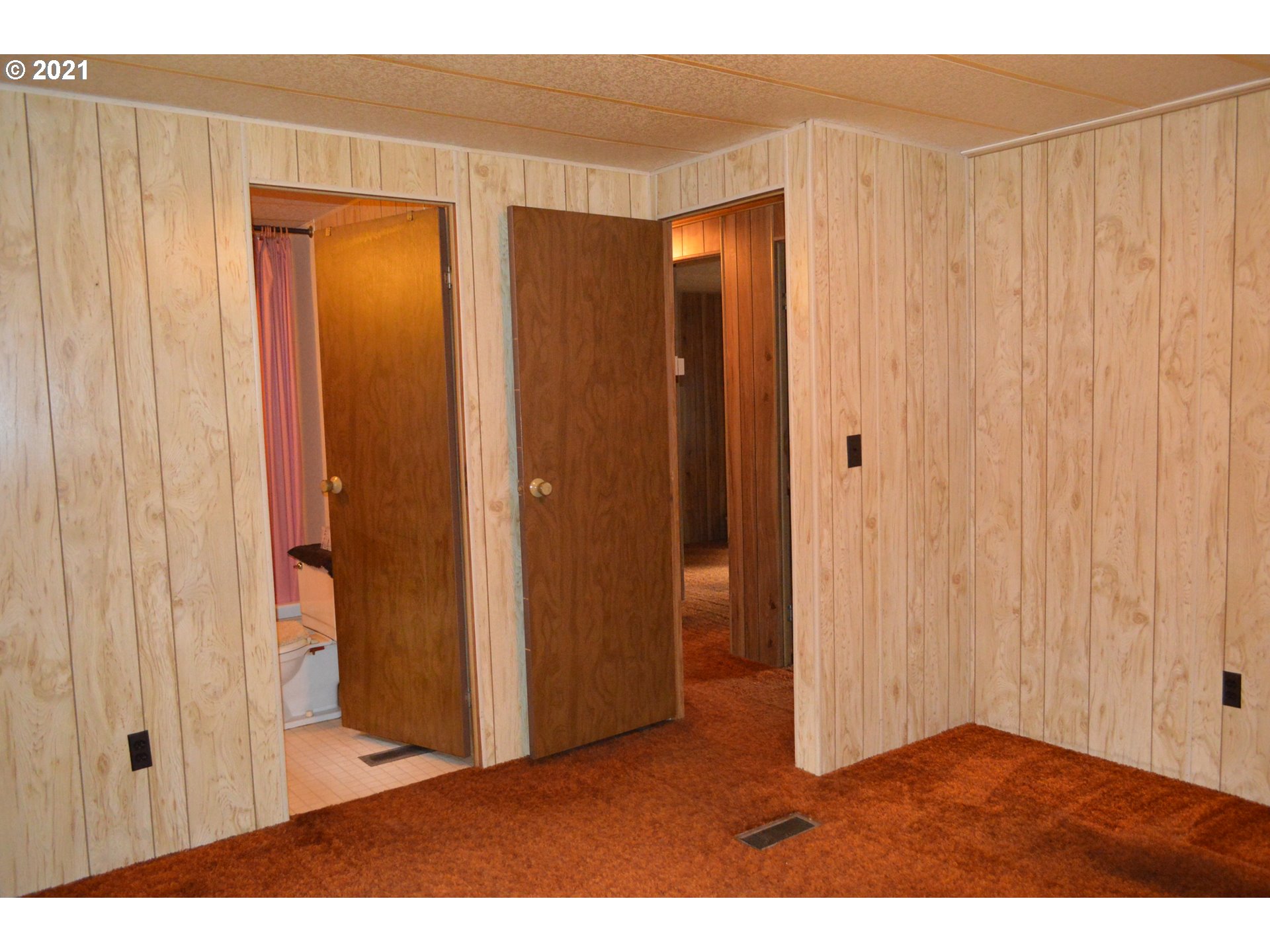 38181 Row River Road Dorena, OR 97434 - Photo 7 of 24 a view of an empty room with wooden floor