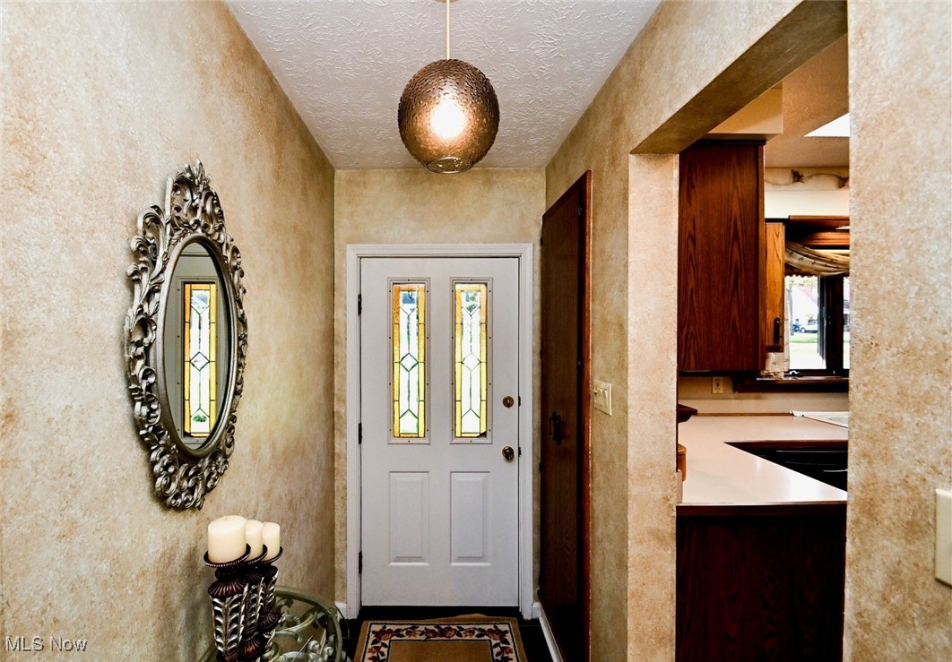 5653 Dailey Road New Franklin, OH 44319 - Photo 6 of 24 Entrance foyer with a textured ceiling