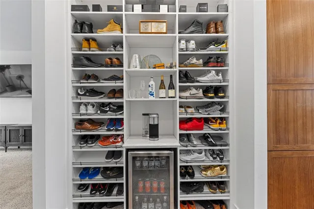 a room with a book shelf and a book shelf