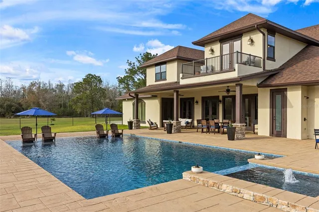 a view of a house with sitting area and furniture