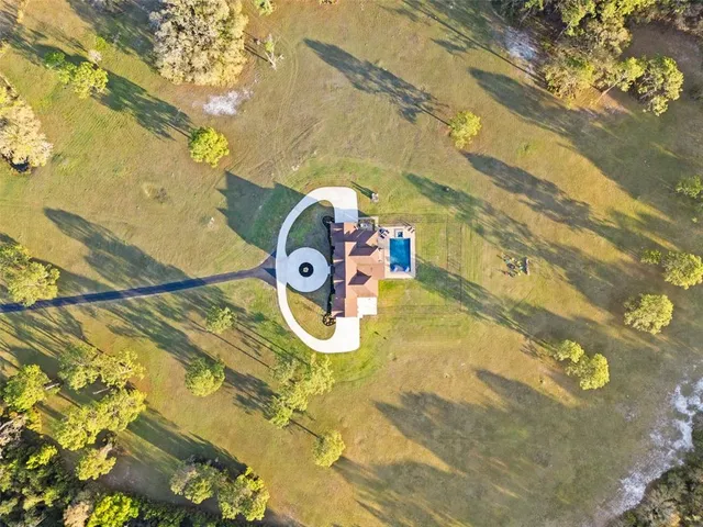 a view of a lake with a table and chairs