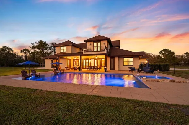 a view of swimming pool with seating space and barbeque in living room